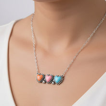 Necklace with pastel-colored heart charms on a white background